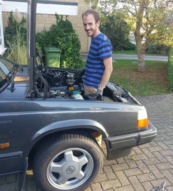 Niall Oswald tending his Volvo 740 Turbo